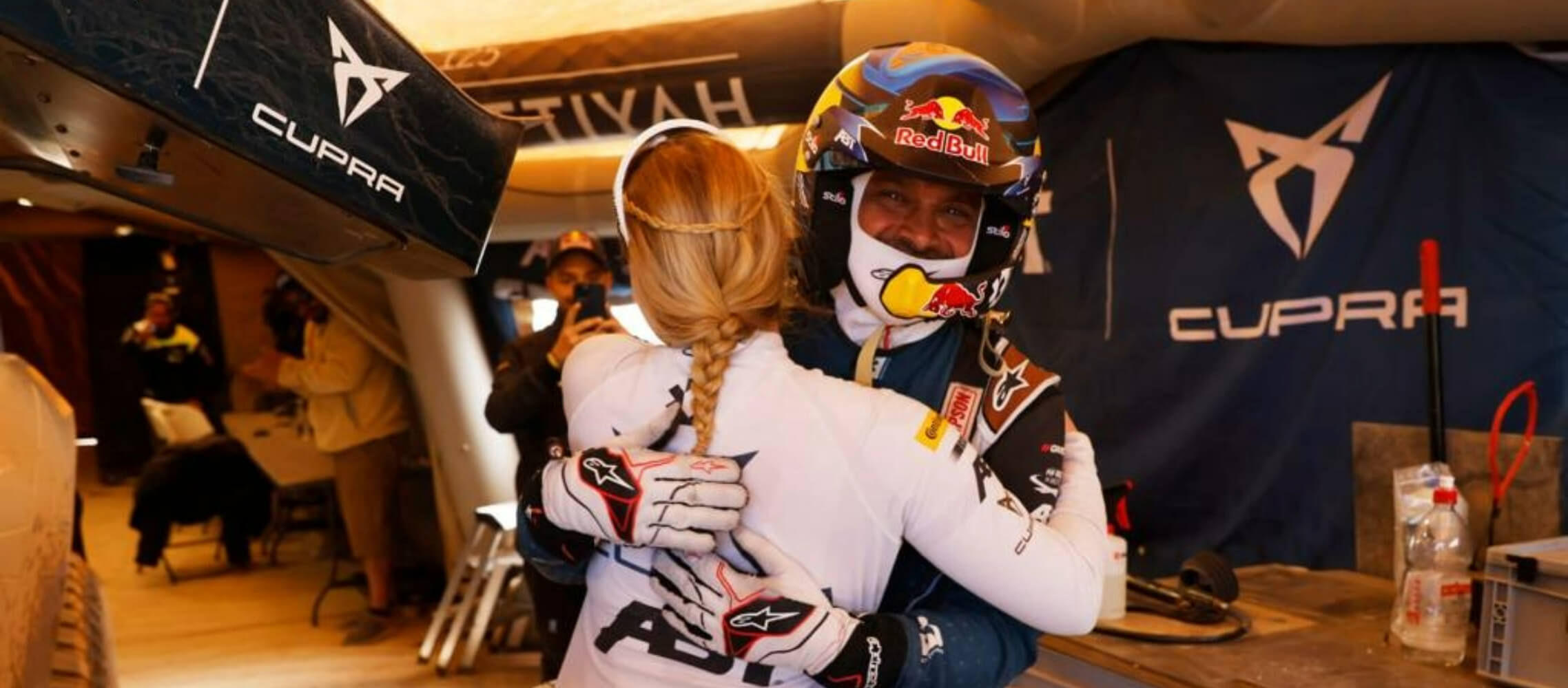 Klara Andersson and Nasser Al-Attiyah celebrating a podium finish