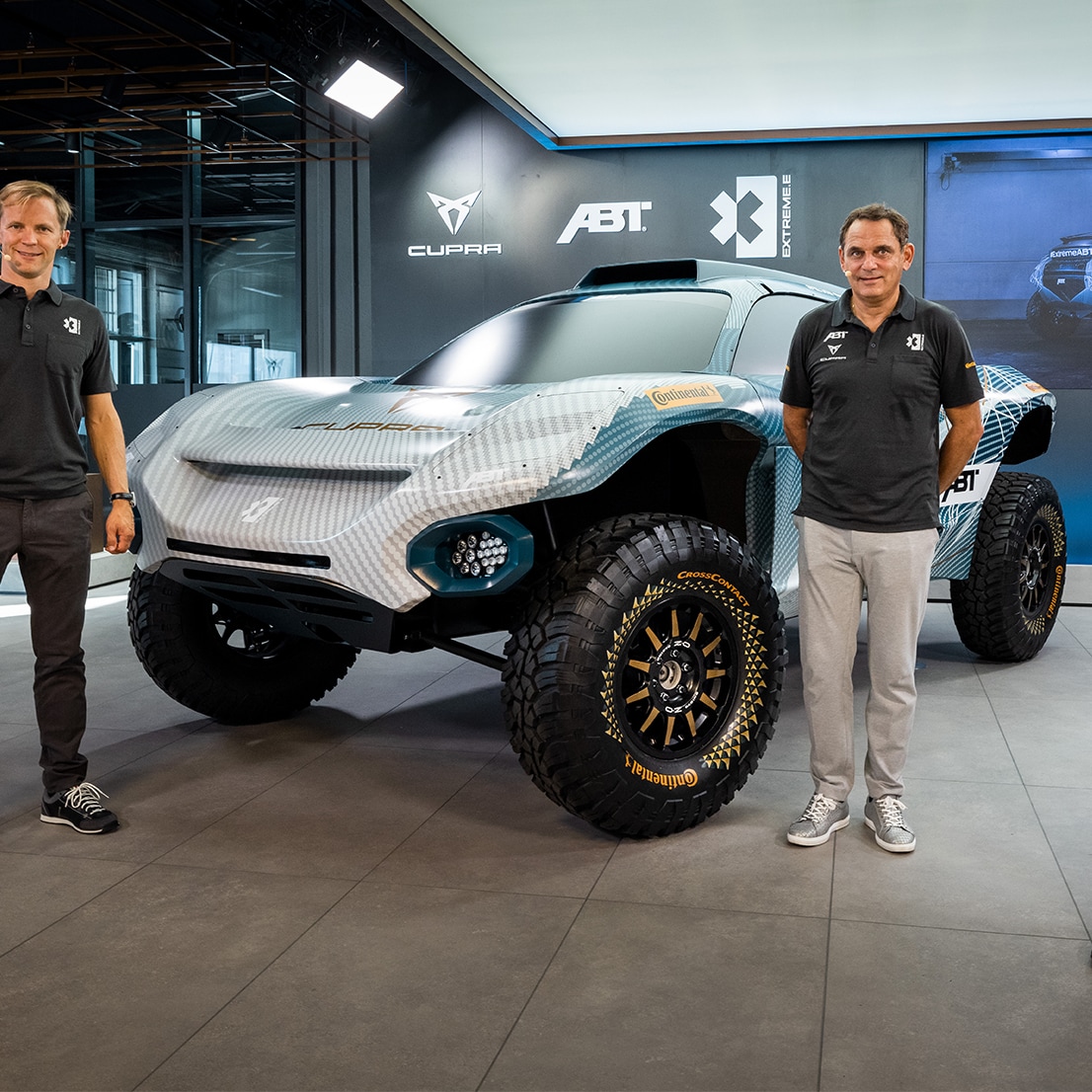 CUPRA team members in front of the CUPRA Tavascan XE