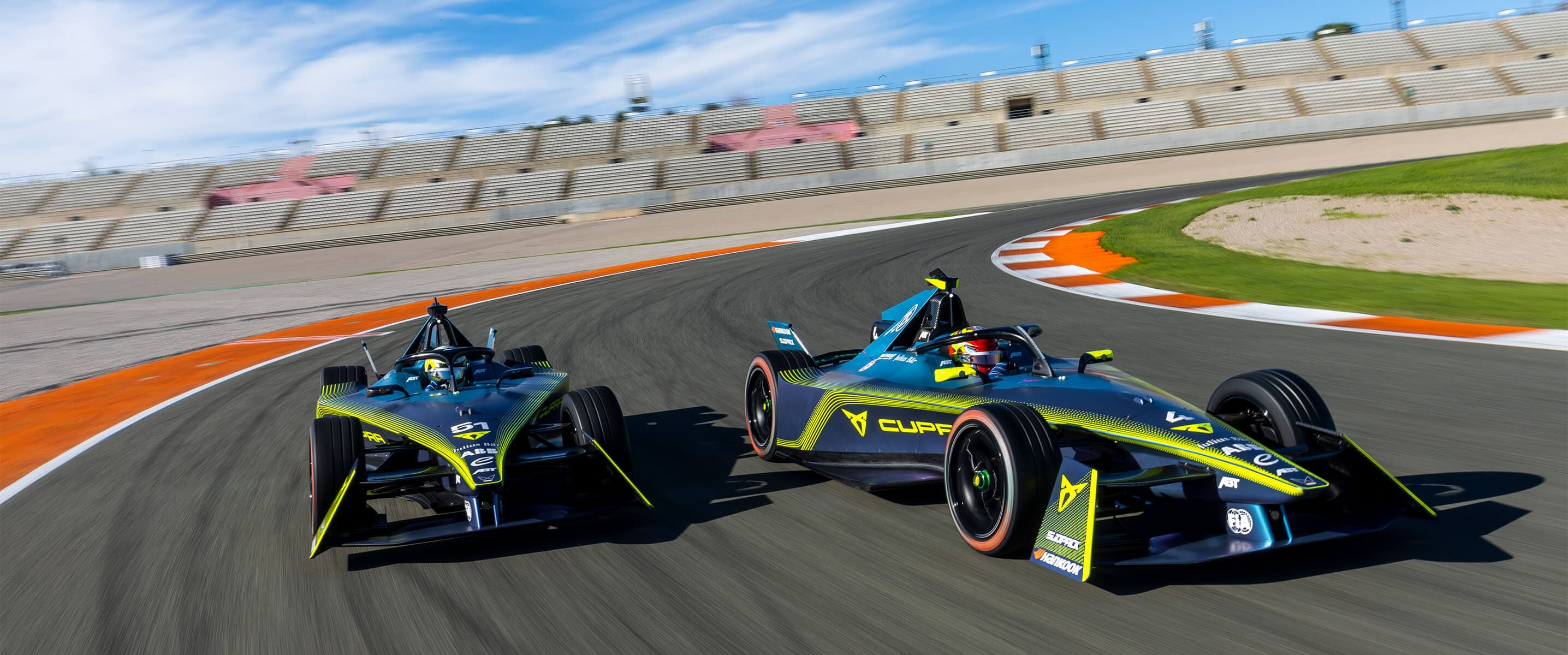 Two ABT CUPRA Formula Es on a racetrack
