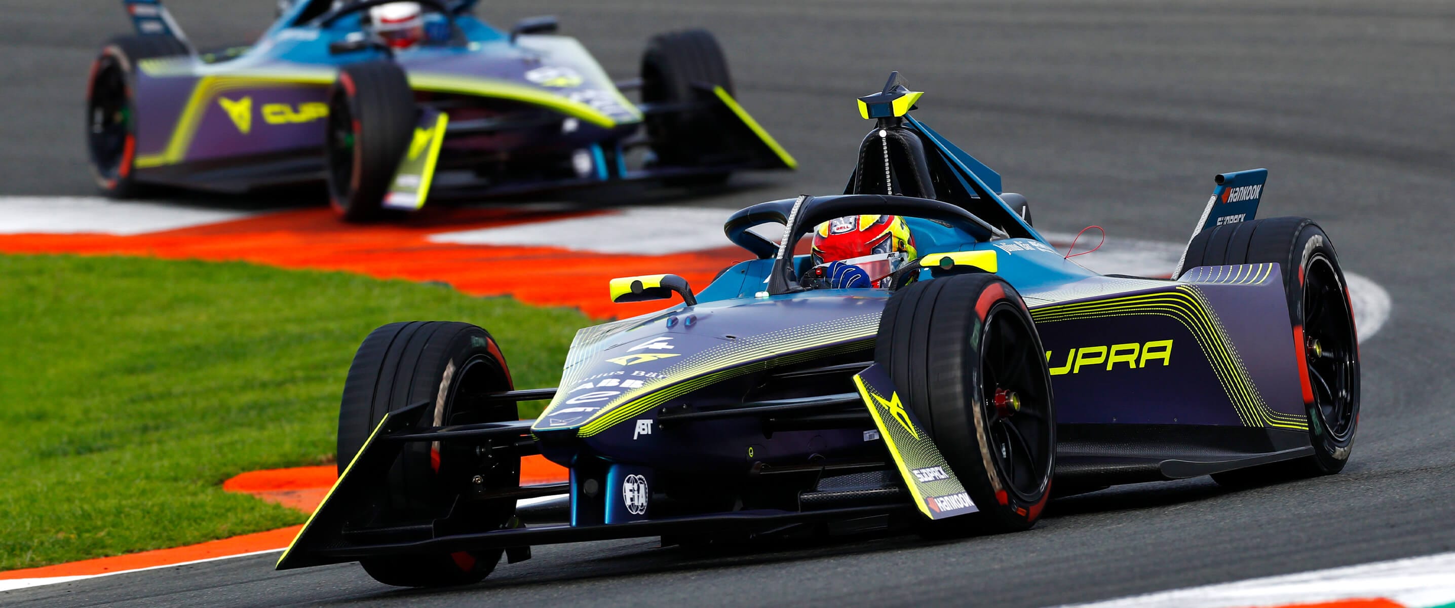 ABT CUPRA Formula E driving on a racetrack