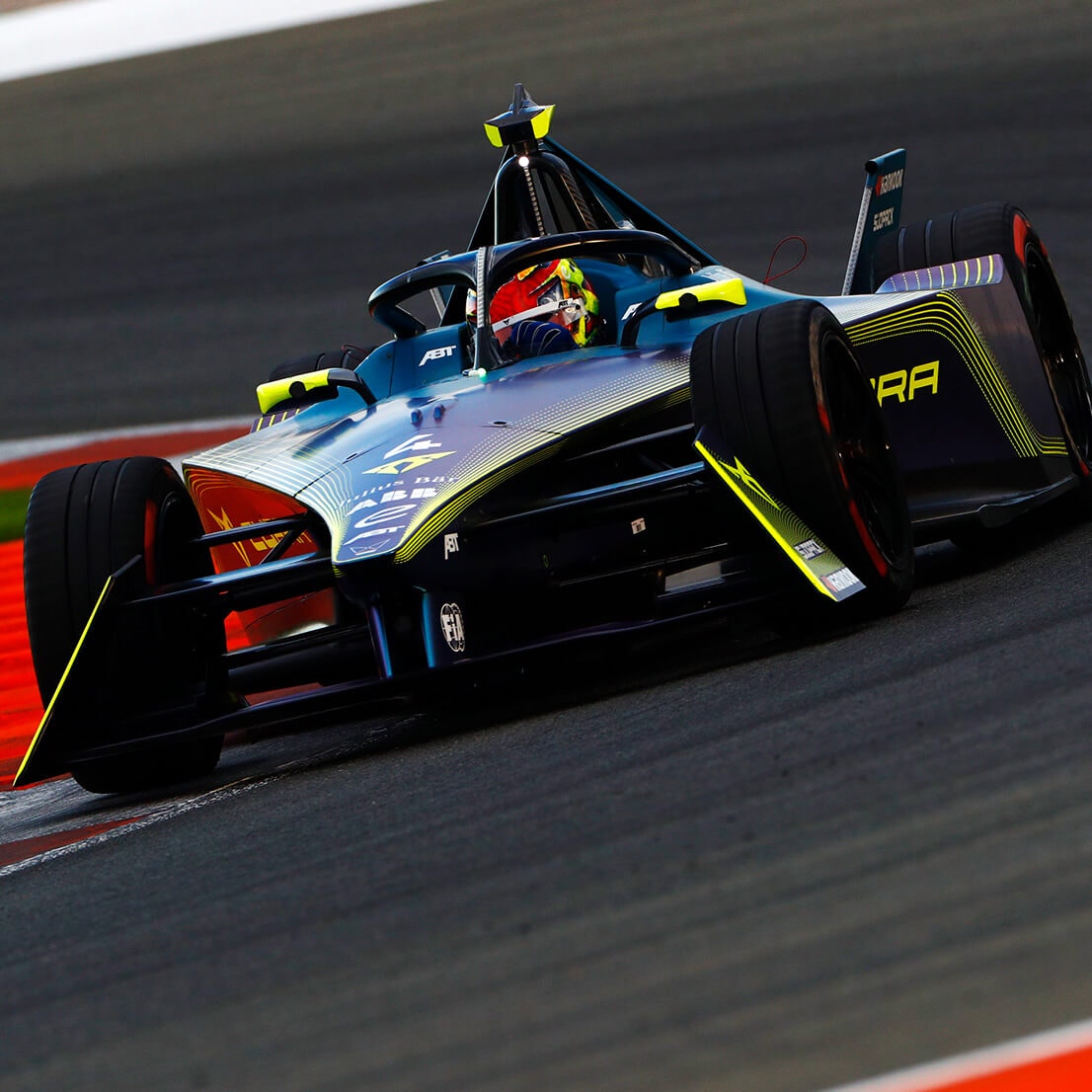 The ABT CUPRA Formula E driving on a racetrack