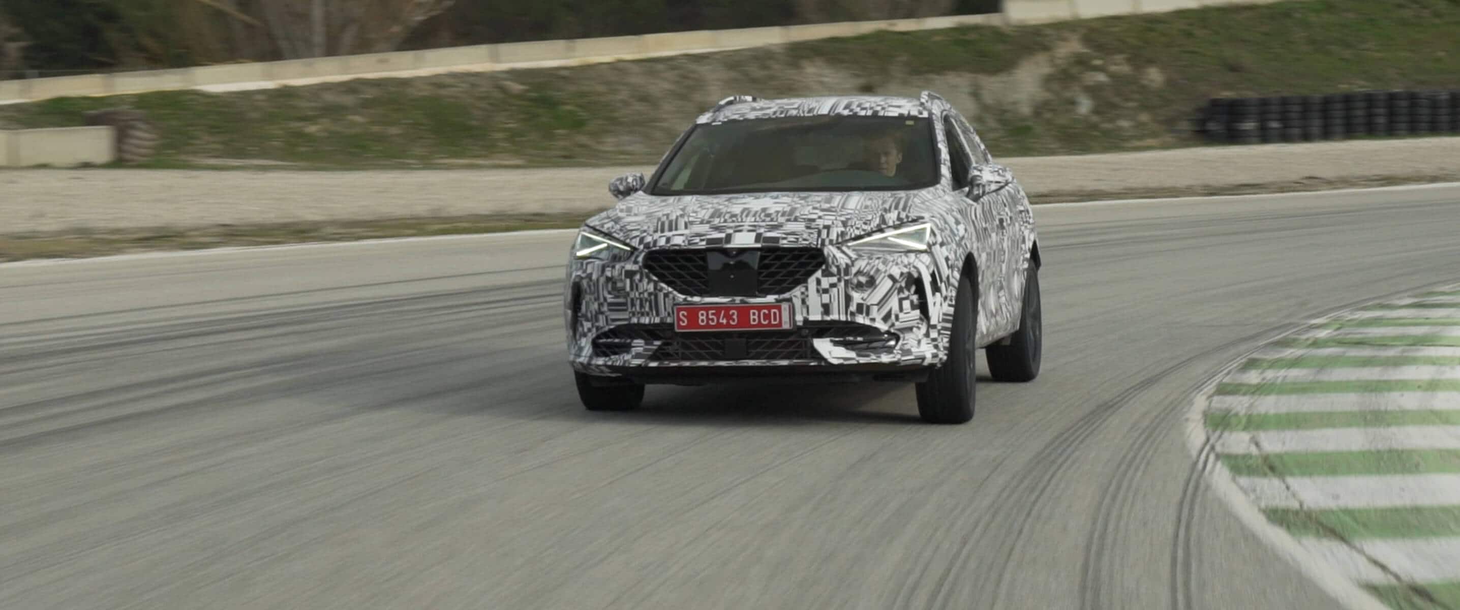 A disguised CUPRA Formentor on a racetrack