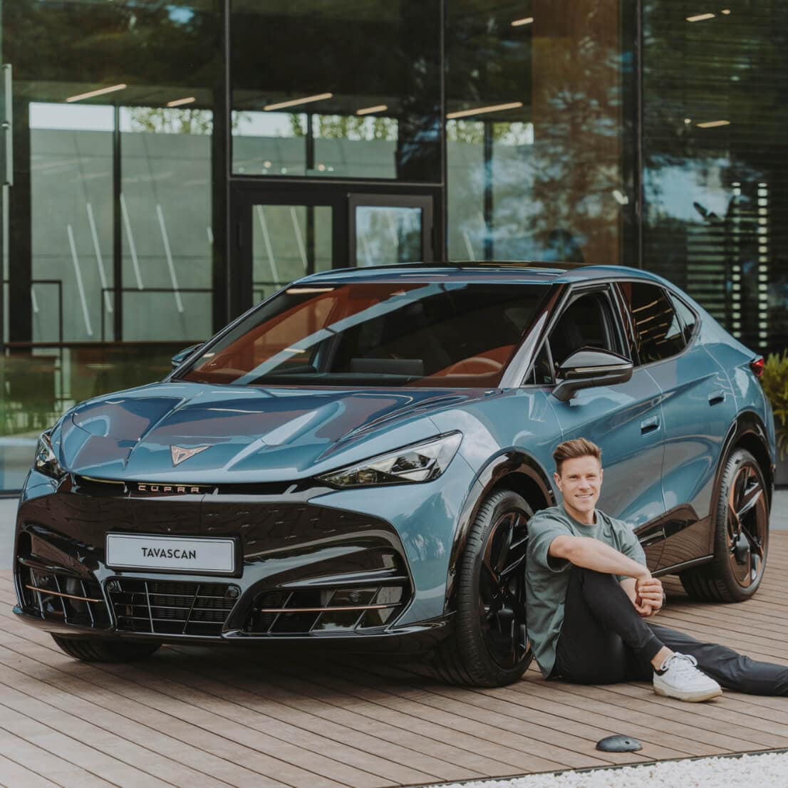 FC Barcelona’s captain Marc ter Stegen poses next to CUPRA Tavascan