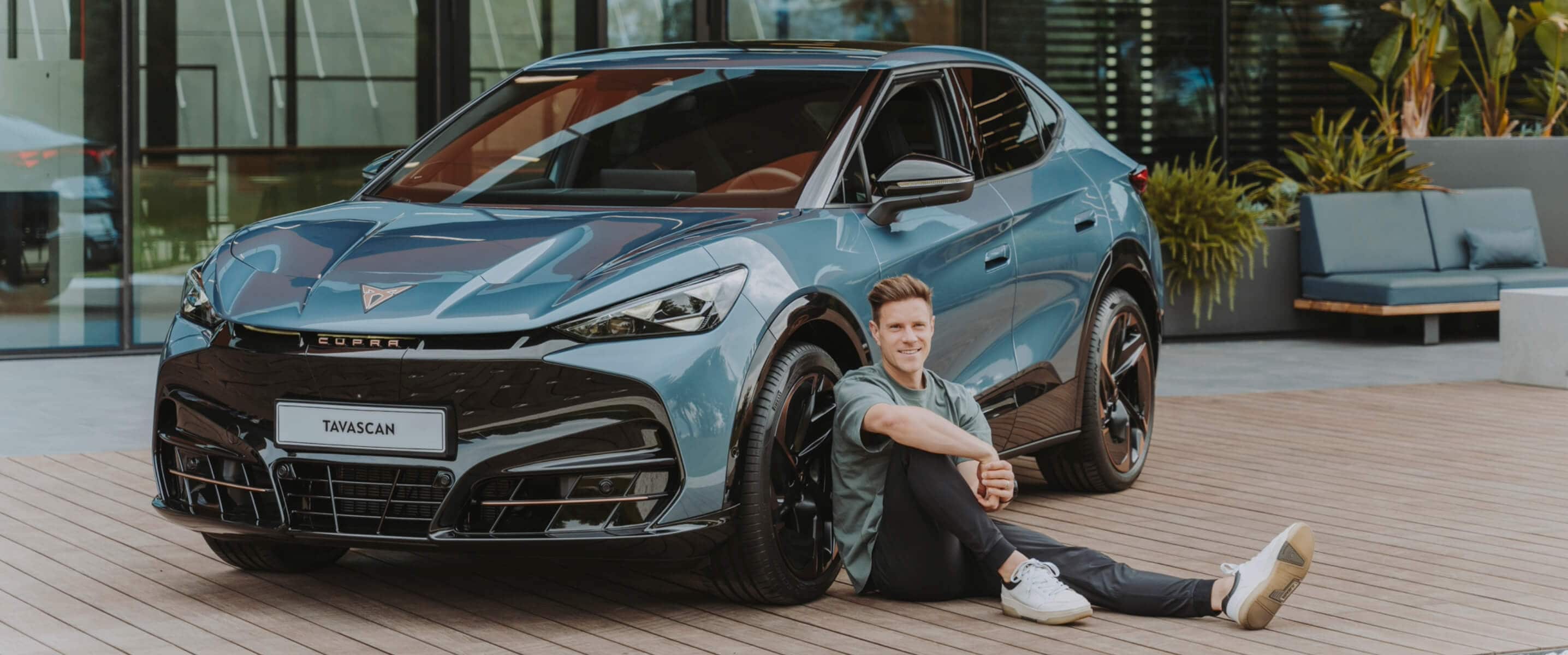 FC Barcelona’s captain Marc ter Stegen poses next to CUPRA Tavascan