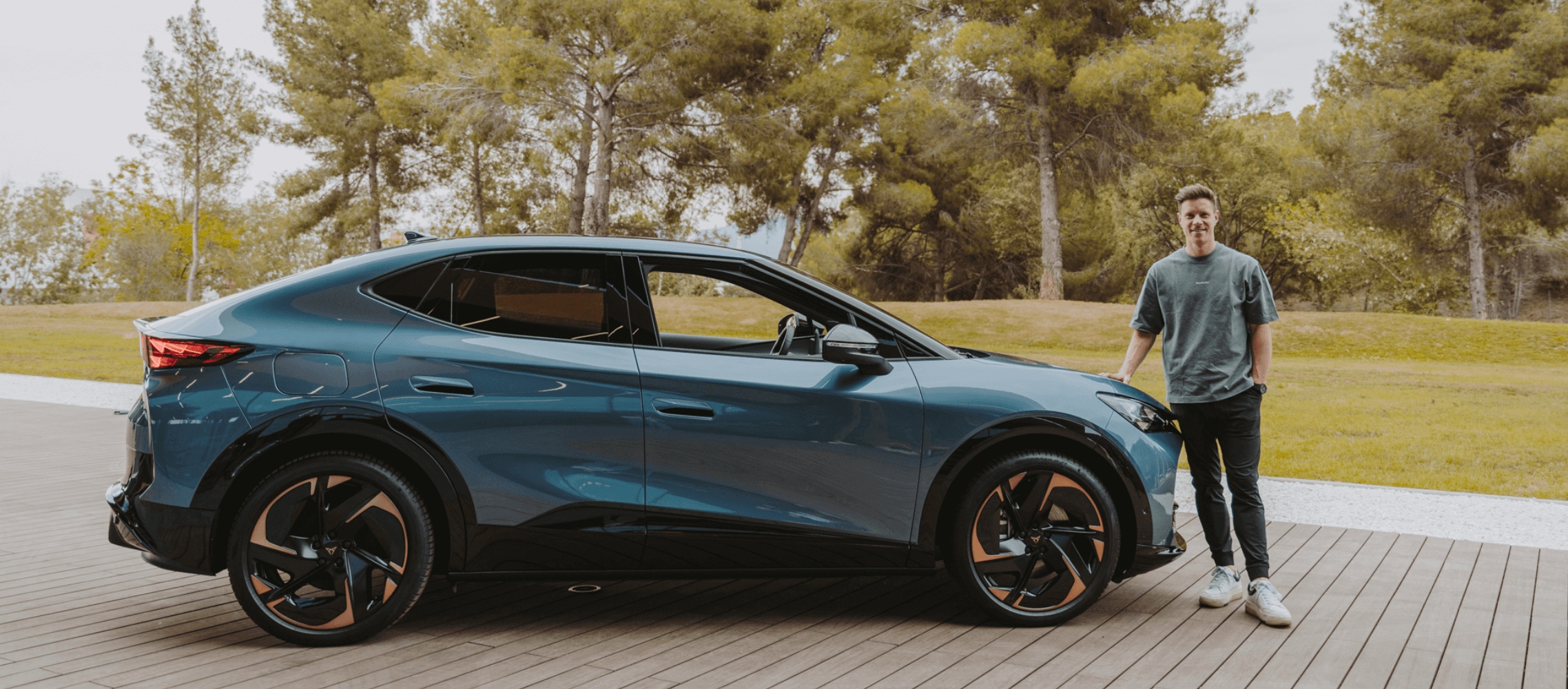 FC Barcelona’s captain Marc ter Stegen poses next to CUPRA Tavascan