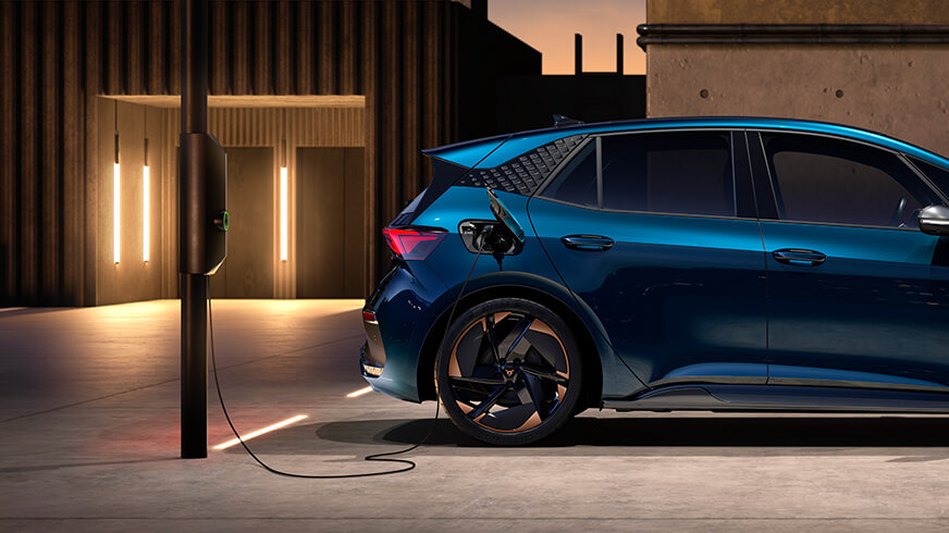 The new CUPRA Born lava blue colour at a charging point
