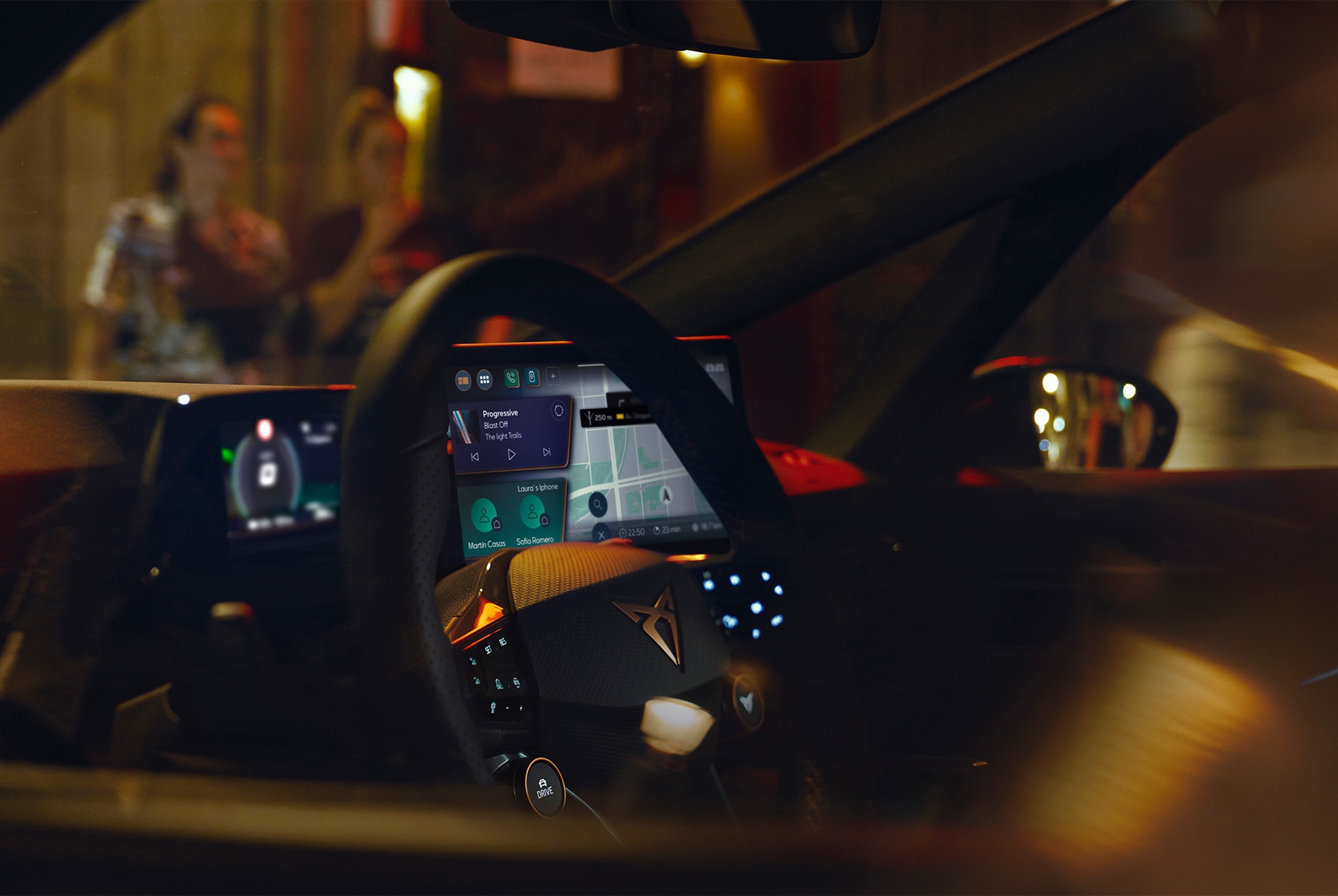 Couple inside a CUPRA Born view of the 12” floating touchscreen