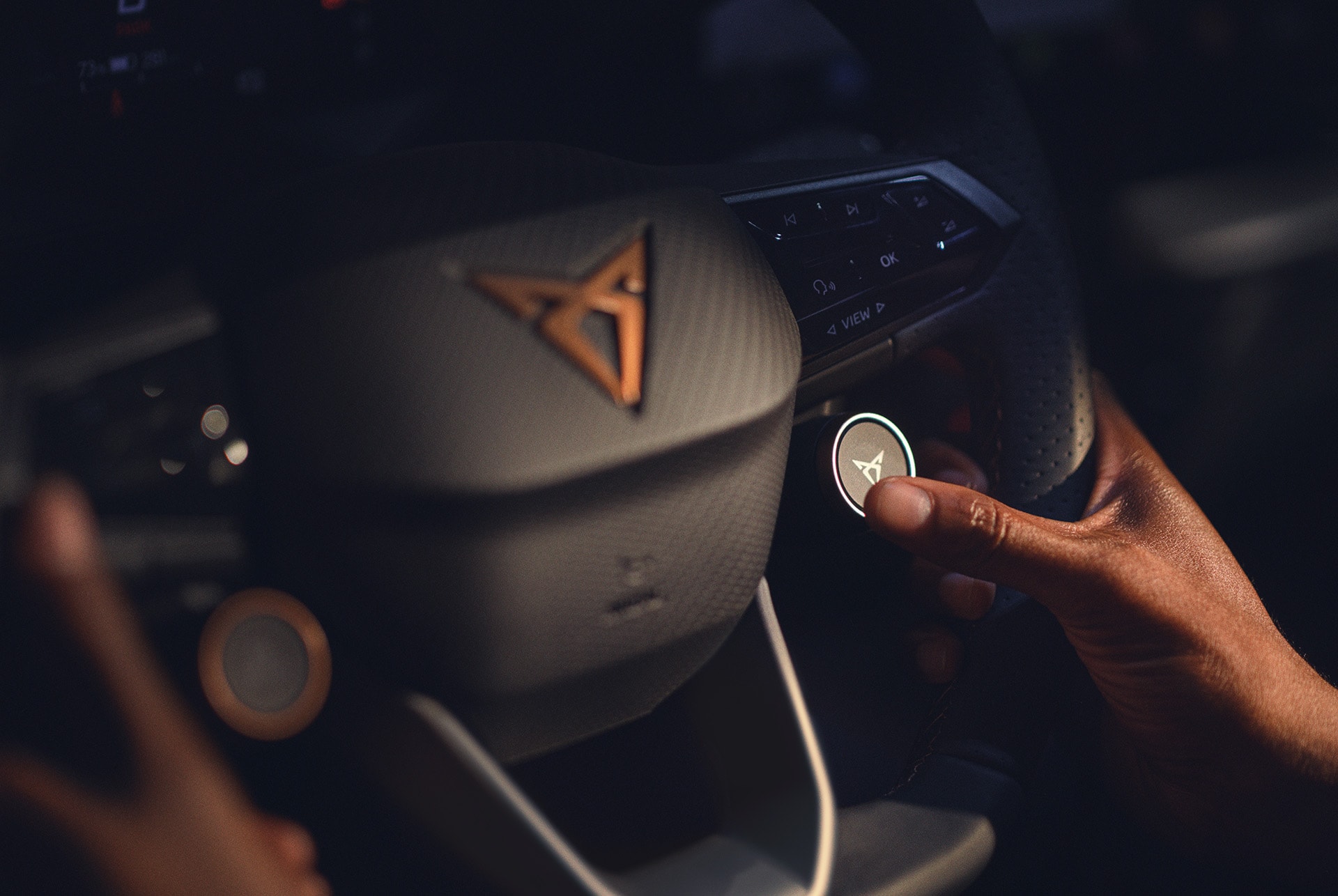 CUPRA Born interior view of the multifunctional steering wheel with satellite buttons