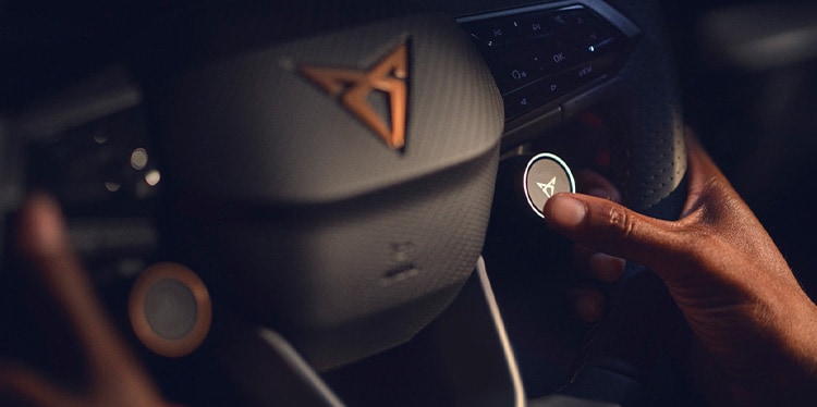 close of of a hand on the wheel of a CUPRA Born