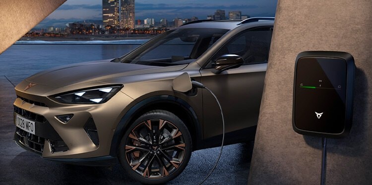 a bronze coloured CUPRA Formentor charging at a wallbox