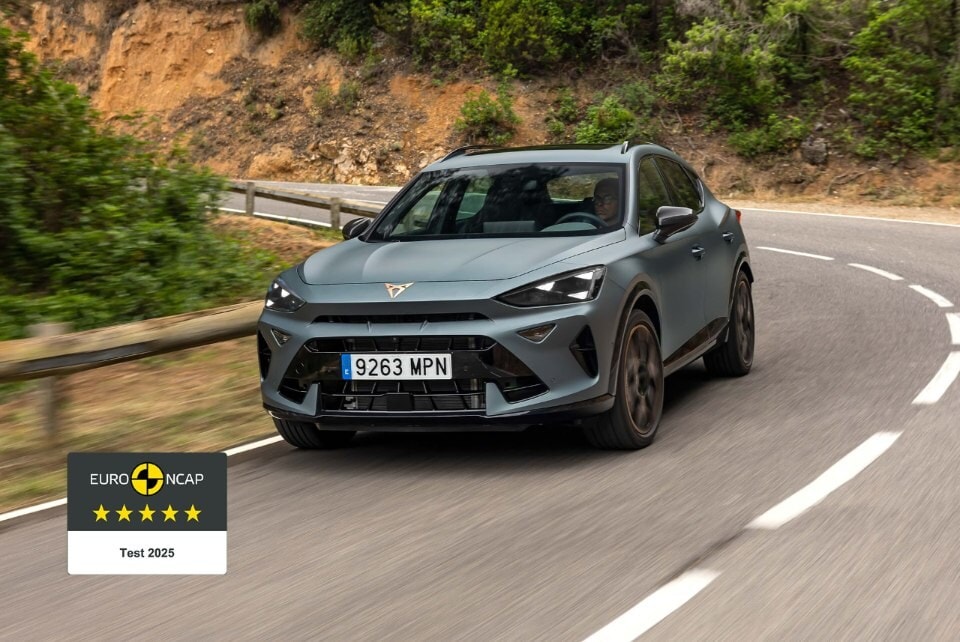 CUPRA Formentor driving down a road with a logo in the bottom left corner awarding Euro NCAP five-star rating in 2025
