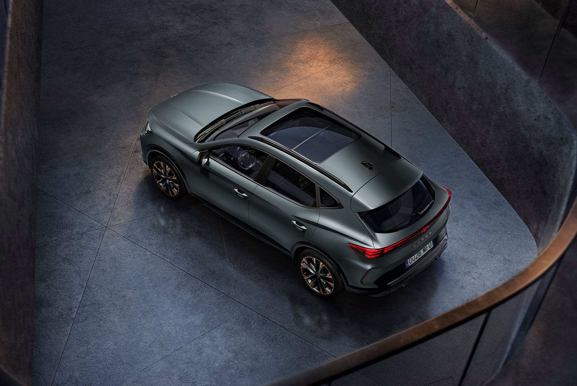 CUPRA Formentor 2026 showcasing its sleek and design, set against a night skyline at its back.