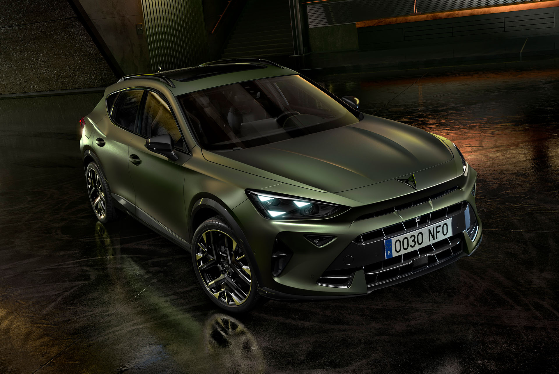 Formentor tribe edition parked in an industrial parking setting that highlights its manganese matt colour. 