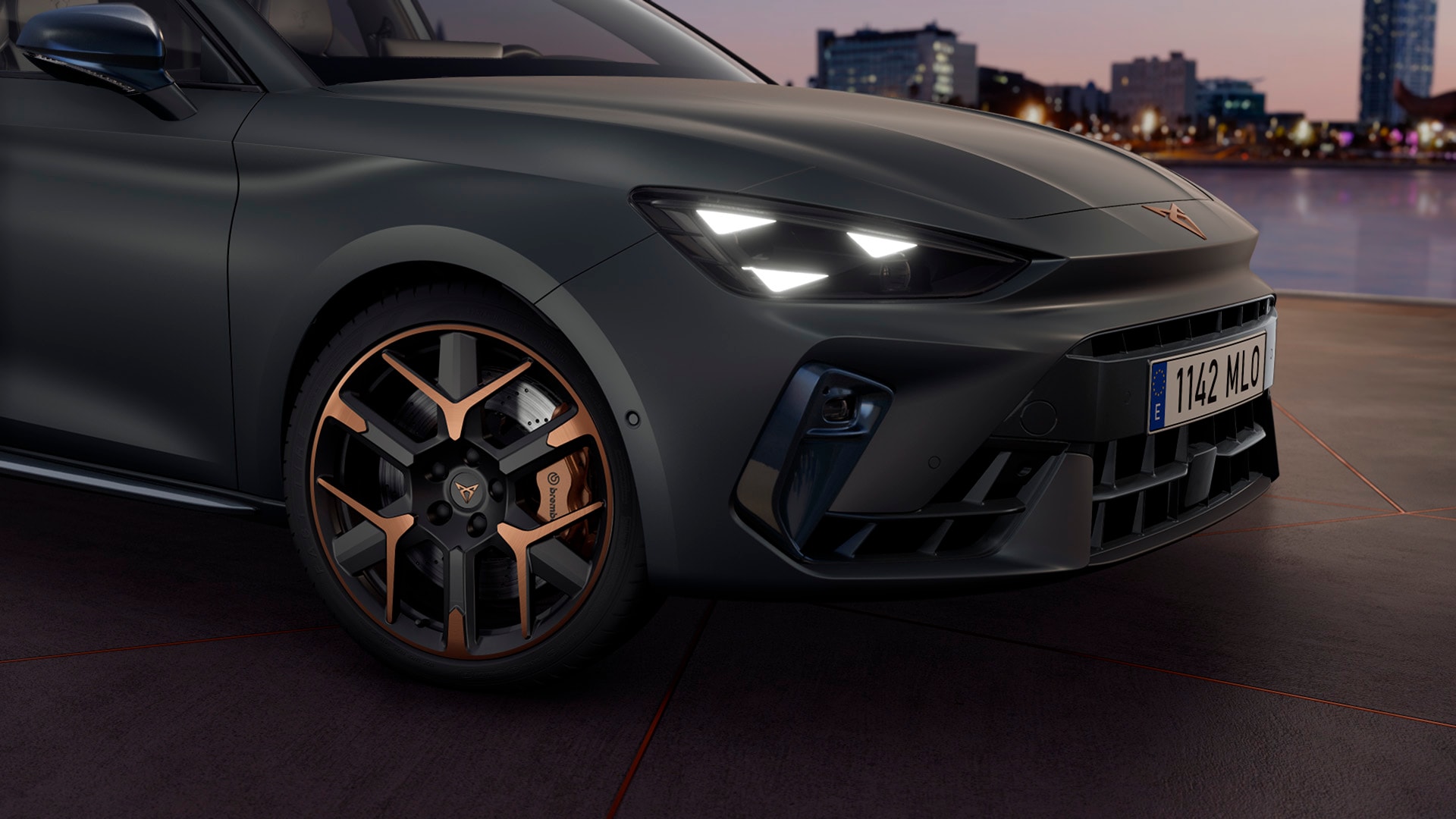 close up of new cupra leon 2025 hailstorm copper accent and black forged wheels with a triangle eye headlight