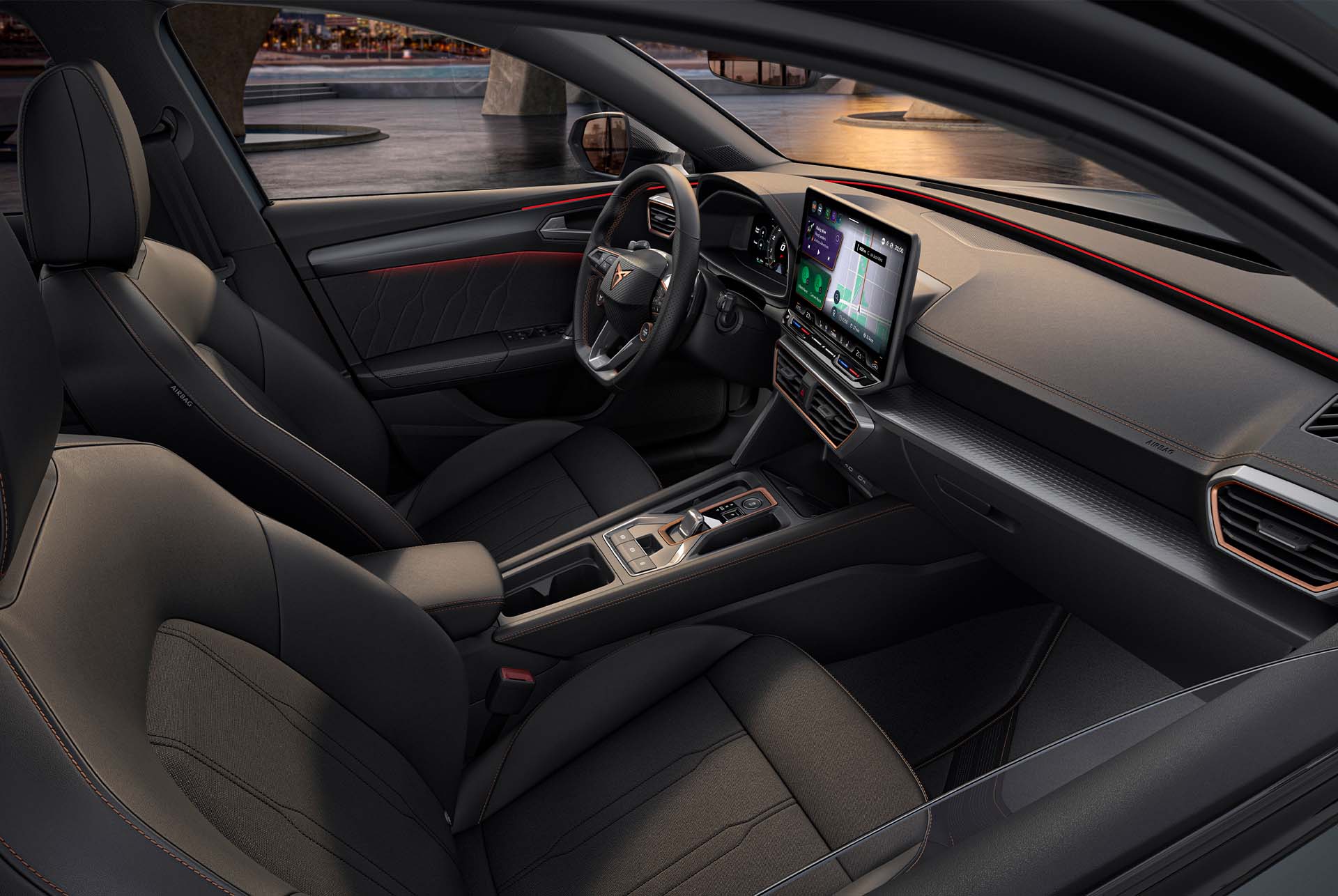 CUPRA Leon Estate 2025 dynamic interior design, sporty bucket seats, ambient lighting, infotainment