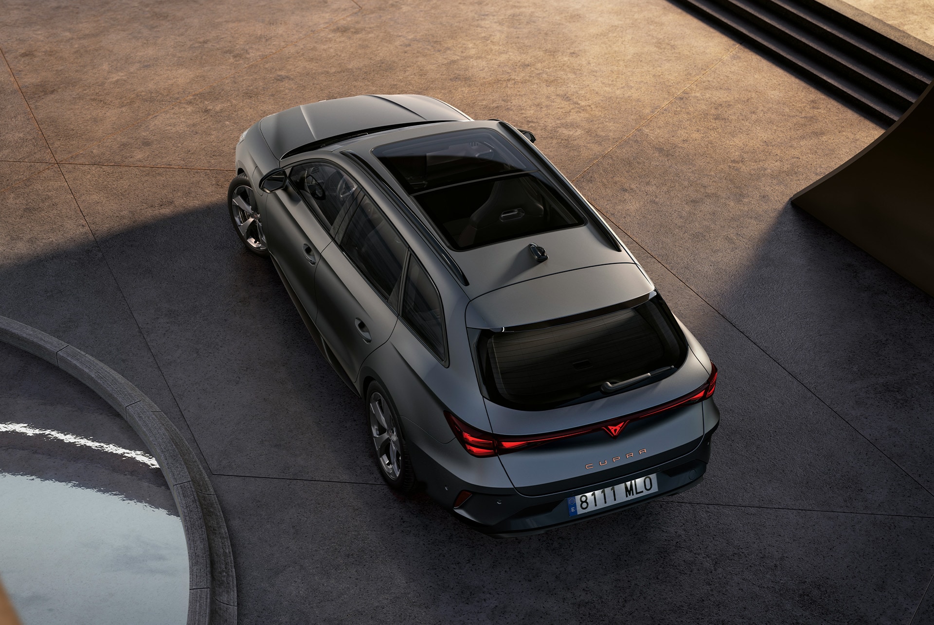 CUPRA Leon Estate 2025 hybrid car technology, parked on concrete, eagle eye with panorama sunroof and electric tailgate
