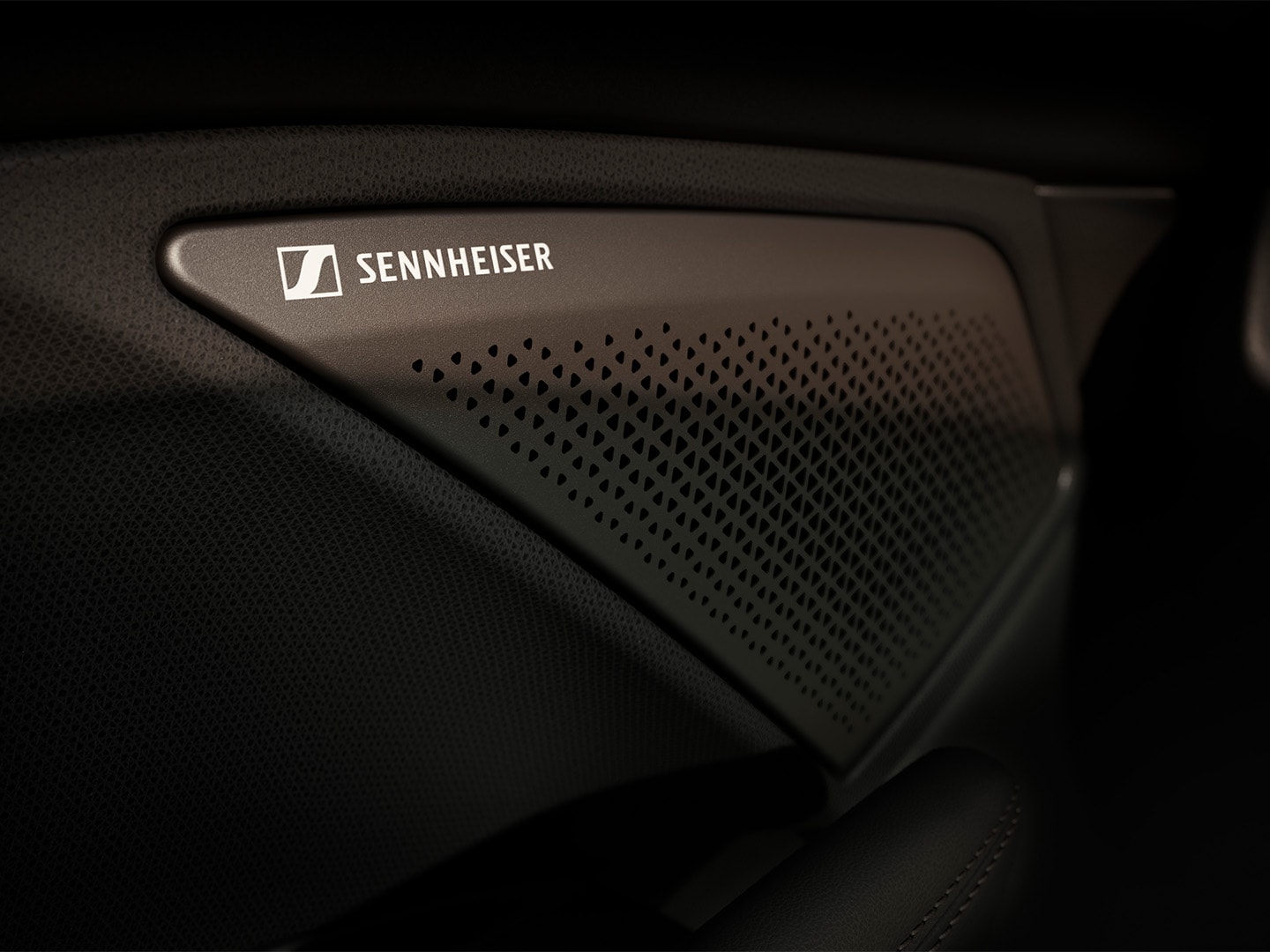 Immersive by sennheiser high fidelity 12-speaker audio system in the CUPRA Terramar showcasing the sennheiser logo. Close up view.