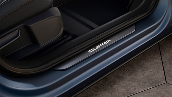 new cupra formentor compact suv with illuminated cupra detailing on door sills.