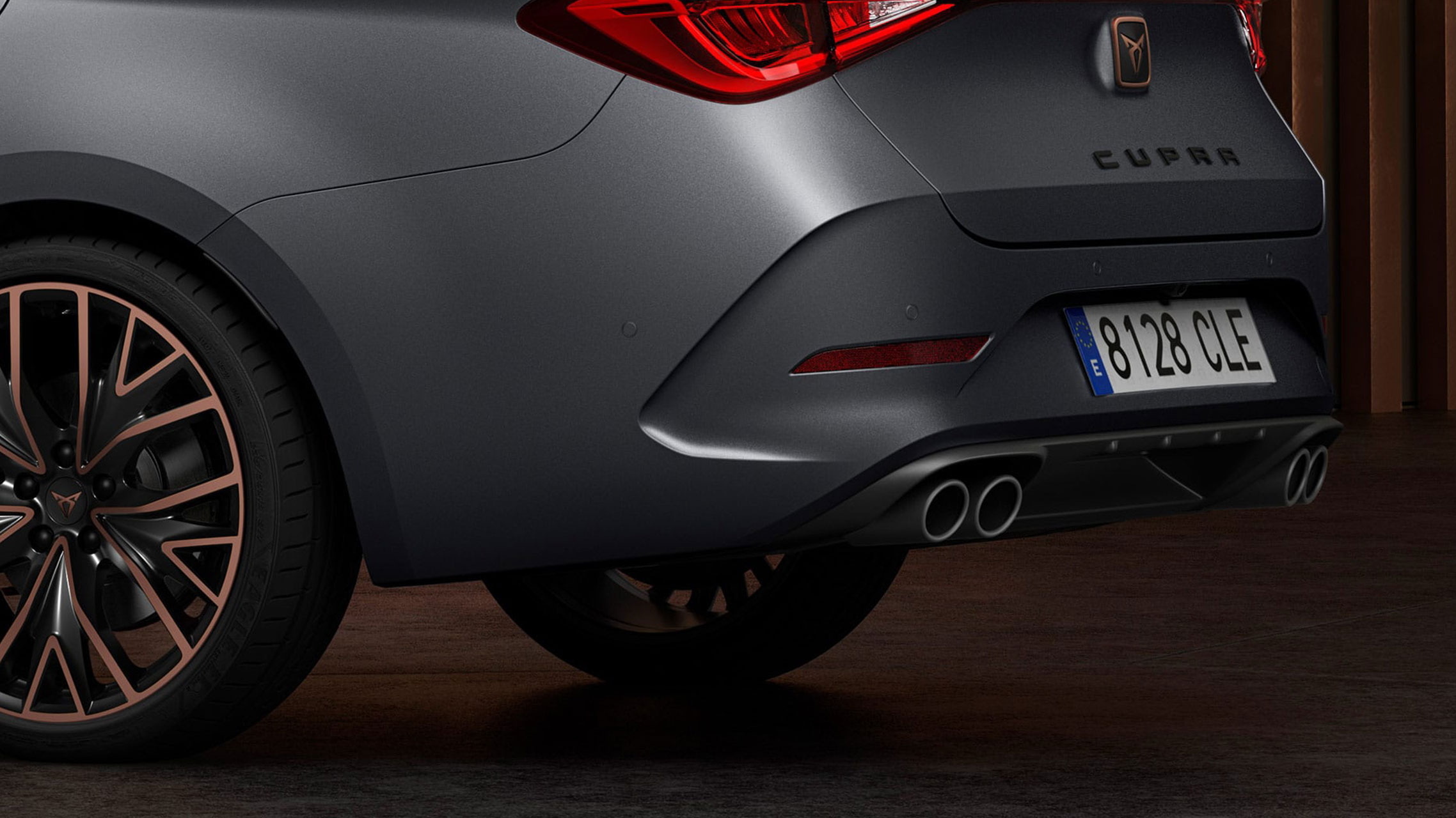 new CUPRA Leon Estate e-HYBRID Family Sports Car closeup view of rear spoiler and 4 exhaust pipes