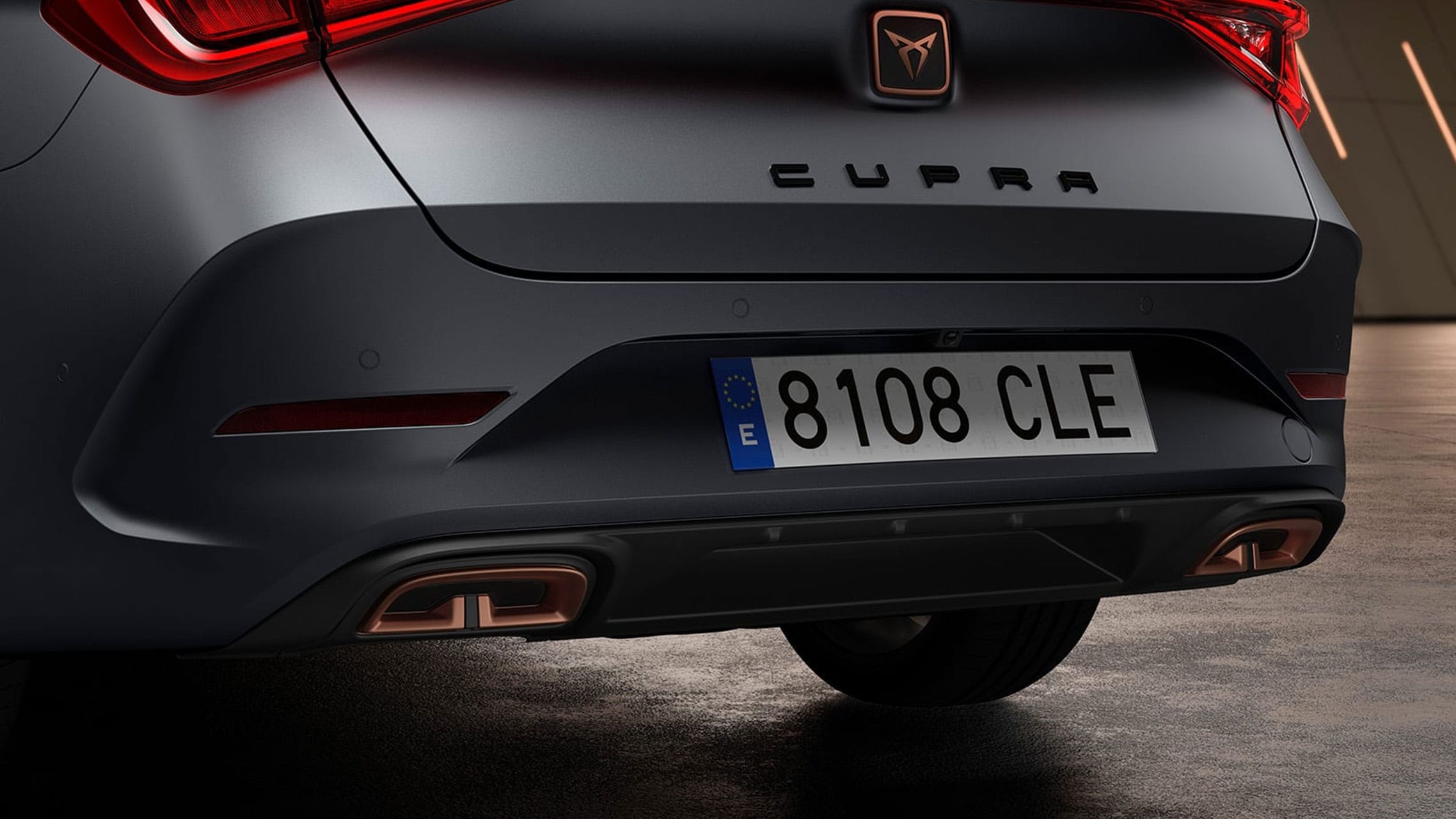 new CUPRA Leon Estate e-HYBRID Family Sports Car closeup view of rear bumper with integrated diffuser and infinite rear light