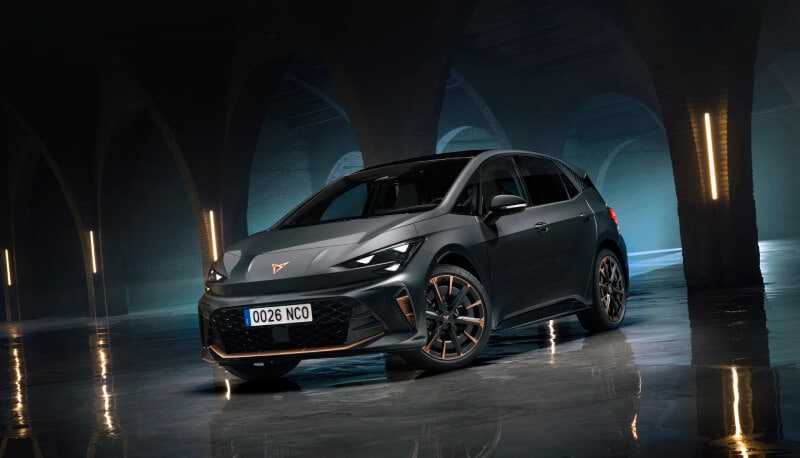 Front view of the new CUPRA Born on a dark industrial background