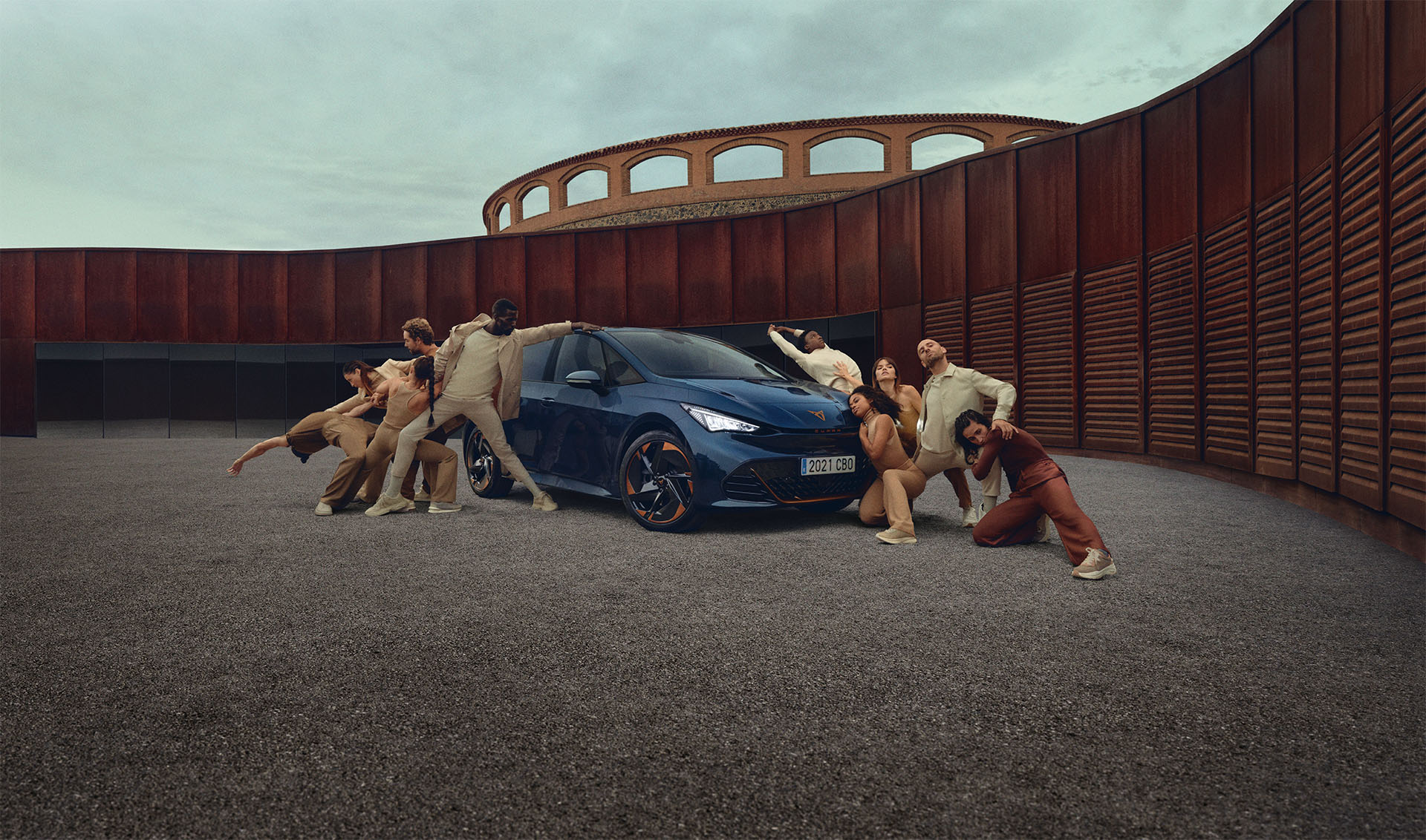 Multiple people posing with CUPRA Born in an artistic way