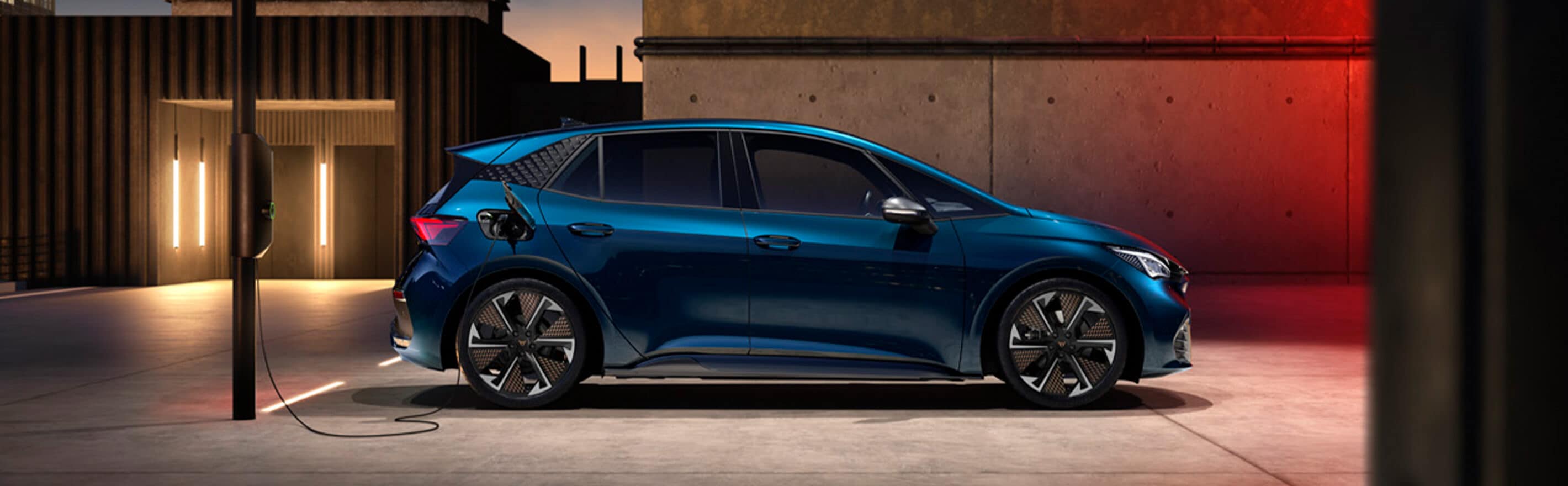 A CUPRA model charging at a public charging station