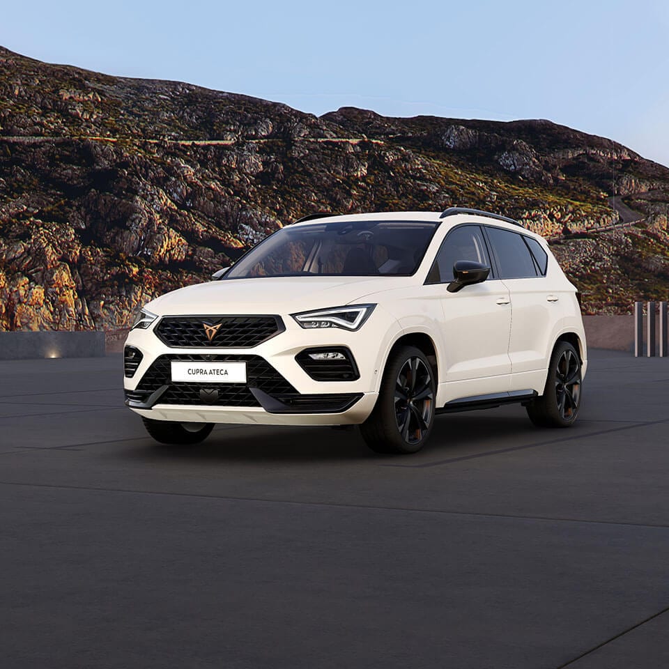 A white CUPRA Ateca parked in a mountainous location