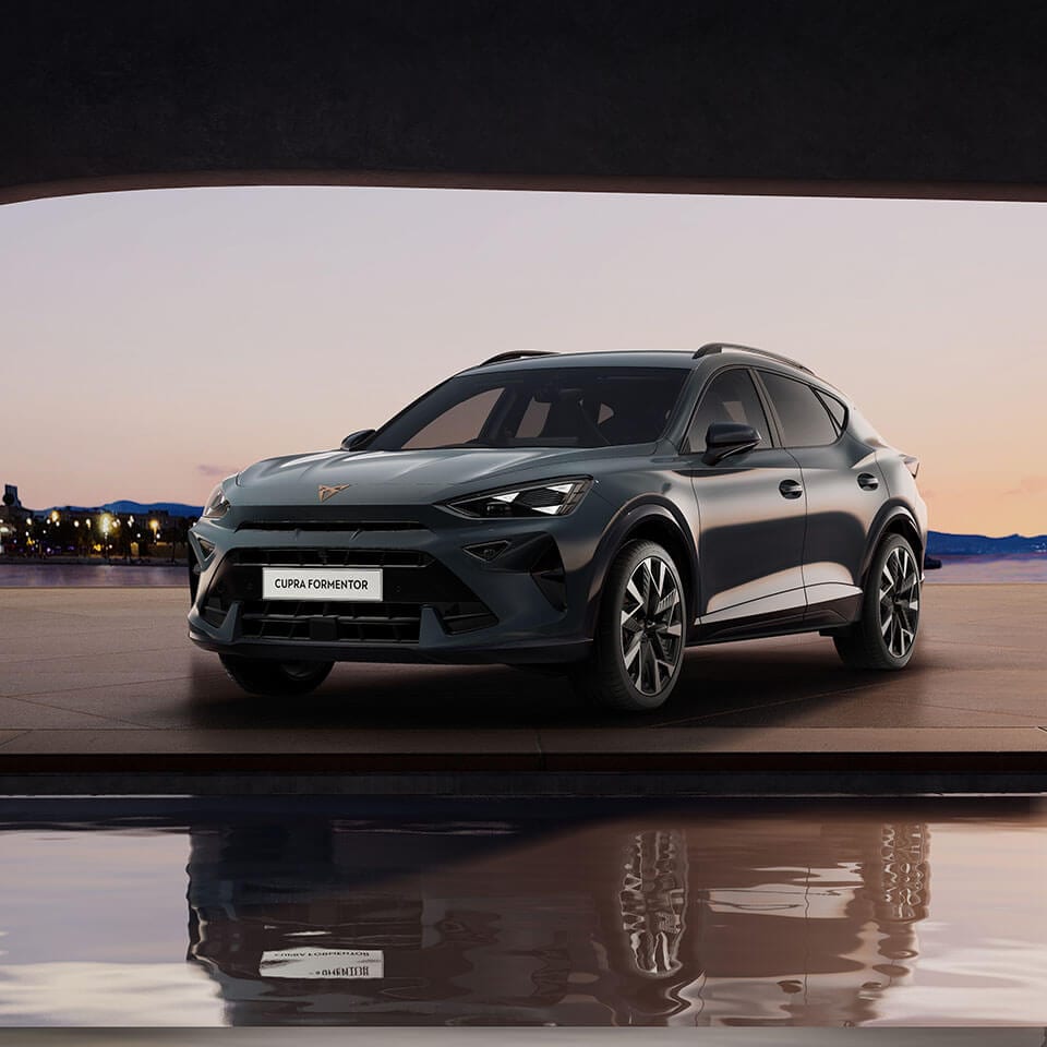 A CUPRA Formentor with a city at night background