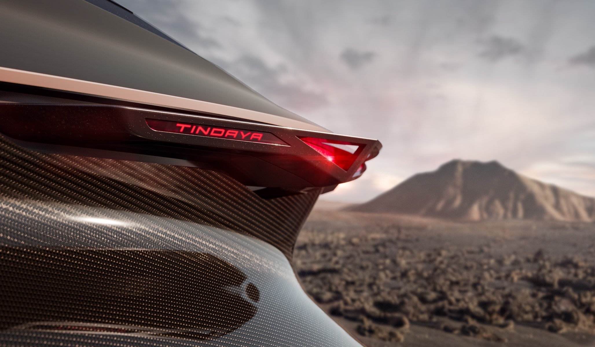 a close up of a the back of a CUPRA Tindaya with a mountain in the background