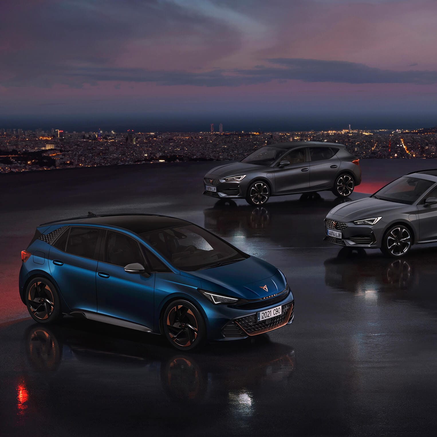  A CUPRA range of Born, Leon and Leon Estate at night time