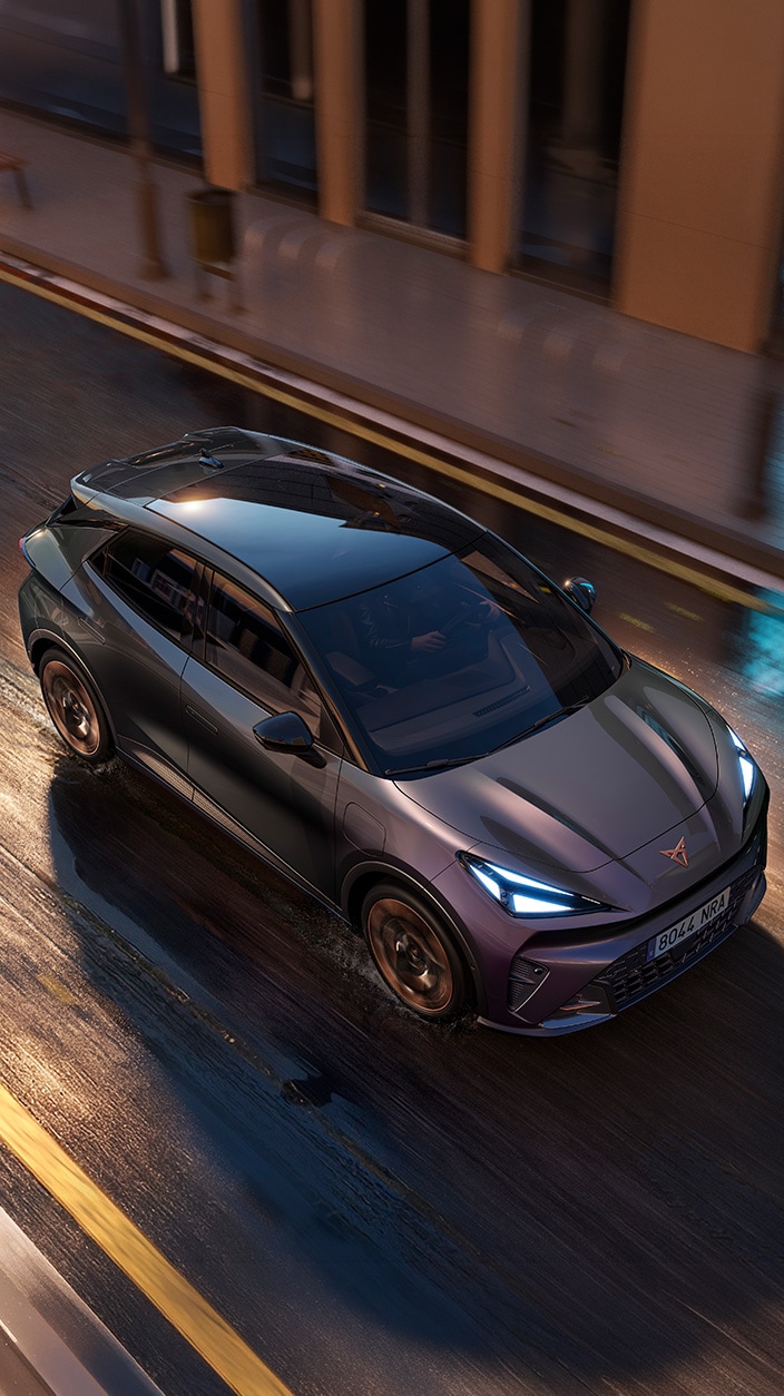 Top view of a moving CUPRA Raval on a wet road