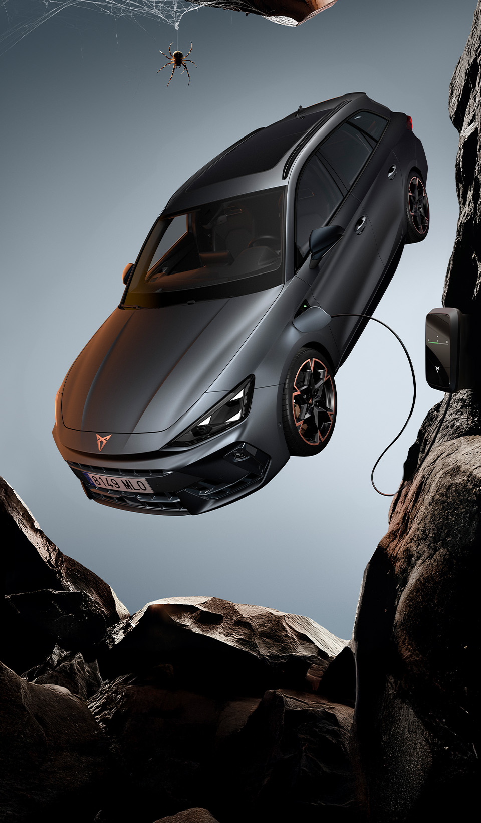 A CUPRA Leon Estate shown from an elevated angle, with a person draped in dark, flowing fabric that creates a dynamic, red-lit trail beside the car