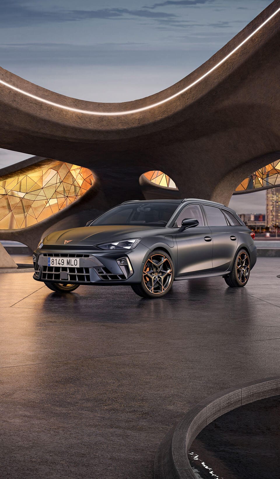 A CUPRA Leon Estate shown from an elevated angle, with a person draped in dark, flowing fabric that creates a dynamic, red-lit trail beside the car