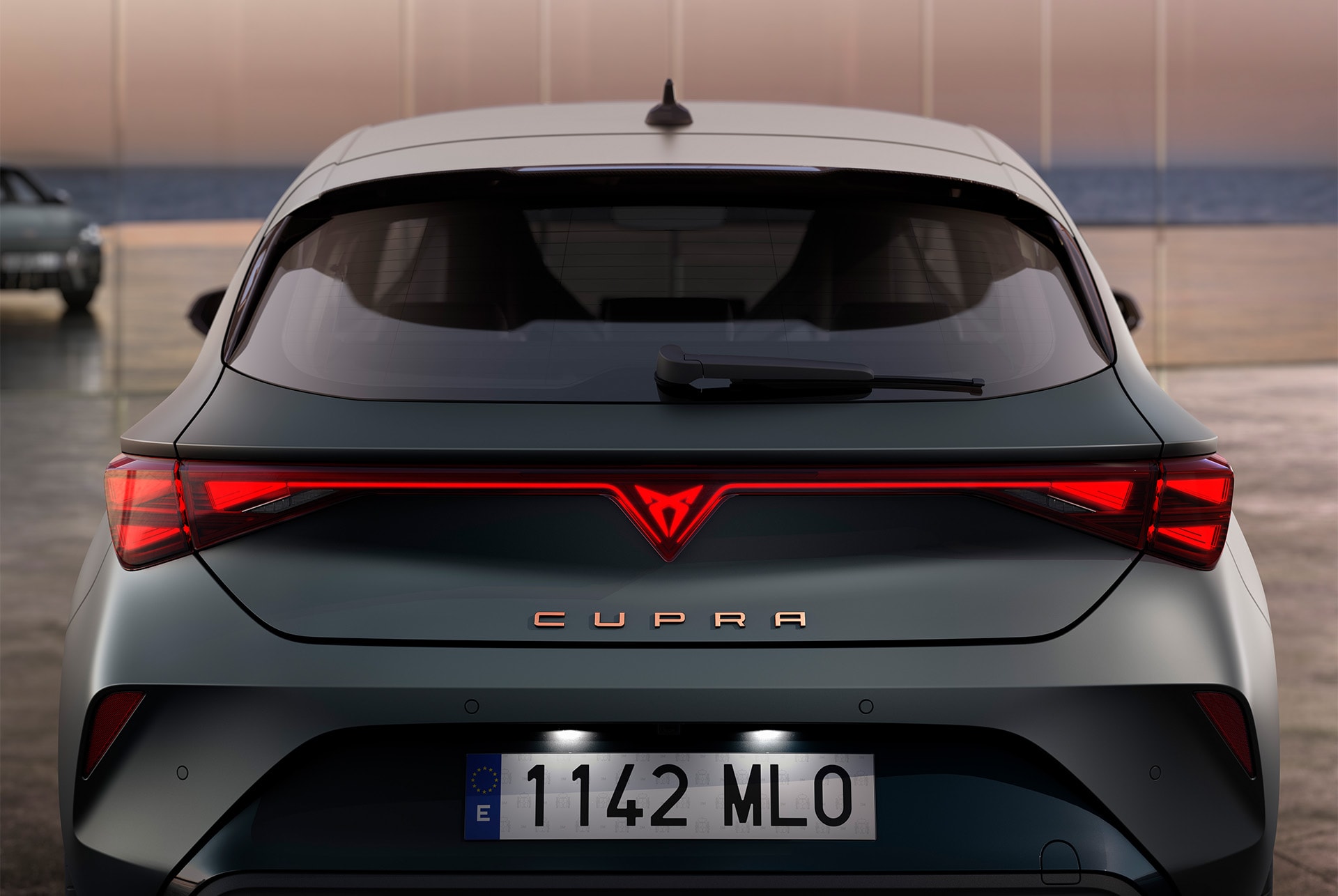 Rear view of CUPRA Leon hybrid car's boot and rear lights, LED lighting, integrated led CUPRA logo