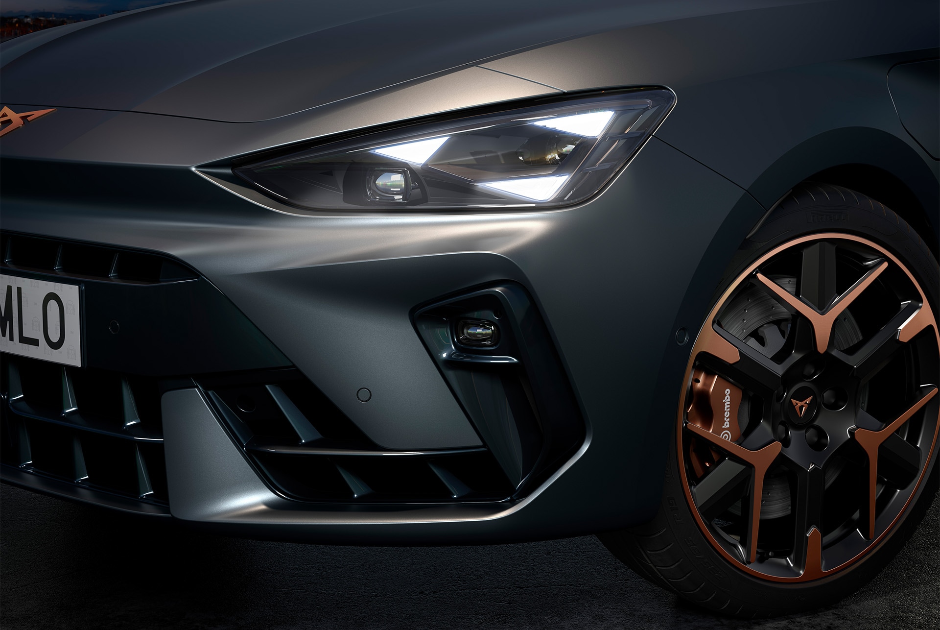 Close up of CUPRA Leon hybrid car, headlights and 19" hailstorm copper accent forged wheels and enceladus grey matt body