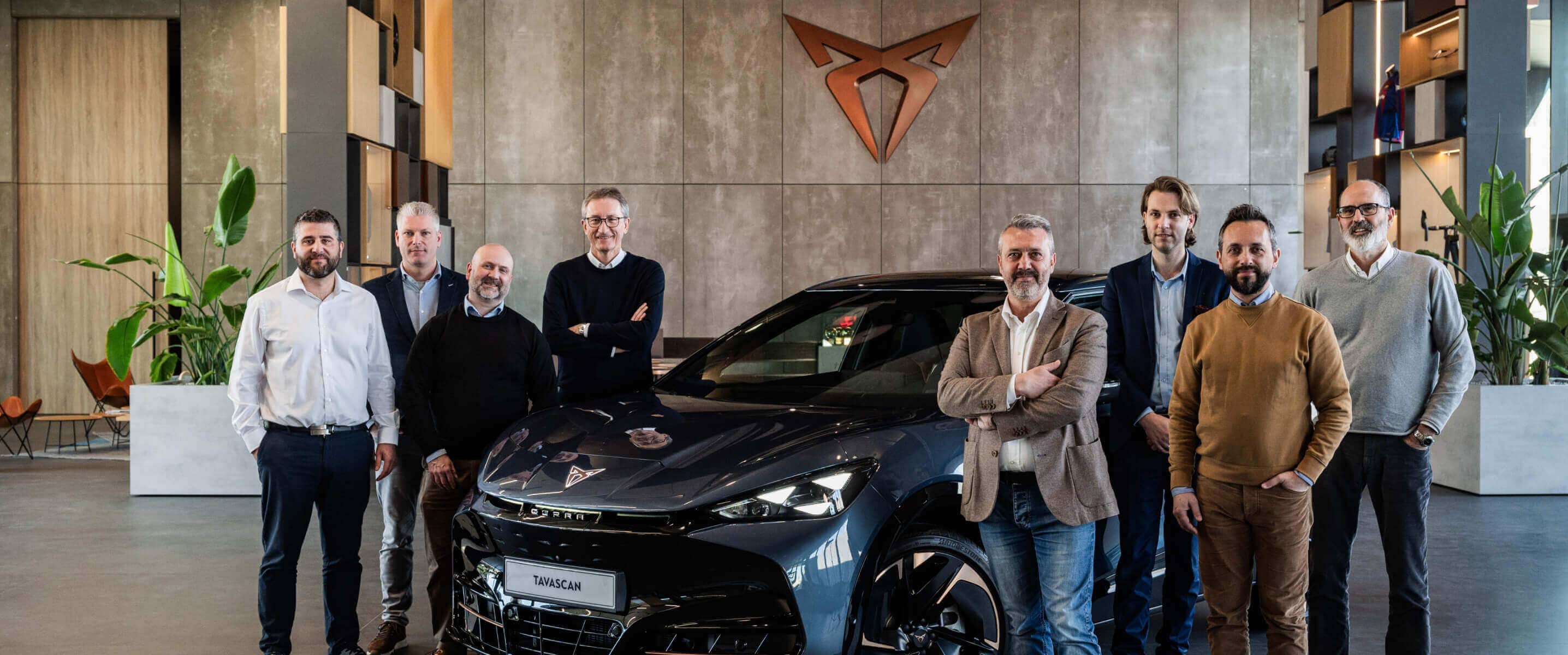 CUPRA Terramar vehicle inside as showroom with fleet managers, copper CUPRA logo on the wall.
